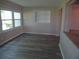 Inviting living room featuring large windows, built-in shelving, and modern flooring at 9825 41St N St, Pinellas Park, FL 33782