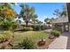 Spacious backyard featuring a manicured lawn, lush landscaping, an outdoor kitchen, and a patio area at 1004 Hollyberry Ct, Brandon, FL 33511