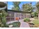Beautiful screened in back porch with stone pathway at 1004 Hollyberry Ct, Brandon, FL 33511