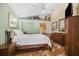 Comfortable bedroom offers natural light, wood-look floors, and plenty of storage space at 1004 Hollyberry Ct, Brandon, FL 33511