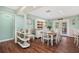 Comfortable dining room with hardwood floors, stylish furnishings, and plenty of natural light at 1004 Hollyberry Ct, Brandon, FL 33511