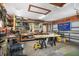 Spacious garage with workbench, ample shelving, and storage, ideal for projects and organization at 1004 Hollyberry Ct, Brandon, FL 33511