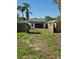 View of detached garage through the backyard gate at 1004 Hollyberry Ct, Brandon, FL 33511