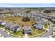 An aerial view of a neighborhood showcasing the property and surrounding community at 10749 Tally Fawn Loop, San Antonio, FL 33576