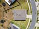 An aerial view of the property, showcasing the roof, yard, and surrounding neighborhood at 10749 Tally Fawn Loop, San Antonio, FL 33576