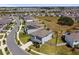 An aerial shot of the house with partial fencing and a view of the surrounding neighborhood at 10749 Tally Fawn Loop, San Antonio, FL 33576