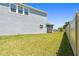 Spacious backyard with lush green grass and privacy fence at 10749 Tally Fawn Loop, San Antonio, FL 33576