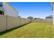 Well-maintained backyard featuring a white privacy fence at 10749 Tally Fawn Loop, San Antonio, FL 33576
