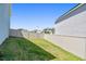 Fenced backyard with green grass at 10749 Tally Fawn Loop, San Antonio, FL 33576