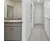 Bathroom with modern vanity and granite countertops at 10749 Tally Fawn Loop, San Antonio, FL 33576