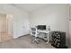 Bedroom featuring wood-look flooring, a gaming setup, and a double door closet at 10749 Tally Fawn Loop, San Antonio, FL 33576