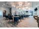 Community clubhouse featuring elegant lighting fixtures, tables and seating, and a refreshment station at 10749 Tally Fawn Loop, San Antonio, FL 33576