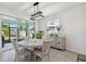 Inviting dining area with sliding glass doors to the backyard and stylish décor at 10749 Tally Fawn Loop, San Antonio, FL 33576