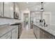 Modern kitchen showcasing granite countertops, stainless steel appliances, and an open layout concept at 10749 Tally Fawn Loop, San Antonio, FL 33576