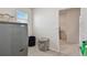 This laundry room includes gray washer and dryer, with a window at 10749 Tally Fawn Loop, San Antonio, FL 33576