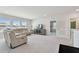 Spacious living area with plush seating, entertainment center, and bright natural light at 10749 Tally Fawn Loop, San Antonio, FL 33576