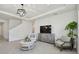 Comfortable living room with stylish decor, neutral colors, and modern lighting at 10749 Tally Fawn Loop, San Antonio, FL 33576