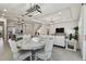 Open-concept living space with kitchen, dining area, living room and staircase, perfect for entertaining and Gathering living at 10749 Tally Fawn Loop, San Antonio, FL 33576