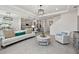 Spacious open-concept living space seamlessly connects the living room, dining area, and modern kitchen at 10749 Tally Fawn Loop, San Antonio, FL 33576