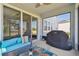 Cozy screened patio with comfortable seating and outdoor grill at 10749 Tally Fawn Loop, San Antonio, FL 33576