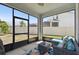 Screened in patio with comfortable seating at 10749 Tally Fawn Loop, San Antonio, FL 33576