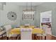 Elegant dining room with decorative chandelier and wainscoting at 1077 Captains Way, Tarpon Springs, FL 34689