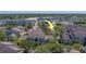 Aerial view of condo buildings and parking lots near a shopping center at 1240 S Missouri Ave # 415, Clearwater, FL 33756