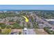 High angle view of apartment community complex set amongst mature trees near schools, shopping, and eateries at 1240 S Missouri Ave # 415, Clearwater, FL 33756