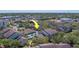 Aerial view of condo buildings with a community pool in a neighborhood at 1240 S Missouri Ave # 415, Clearwater, FL 33756