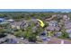 Aerial view of condo buildings, trees and roads of a neighborhood at 1240 S Missouri Ave # 415, Clearwater, FL 33756