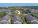 Scenic aerial view of a multi-Gathering residential apartment complex surrounded by lush greenery and trees at 1240 S Missouri Ave # 415, Clearwater, FL 33756