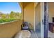 A cozy balcony with a chair and table offers a relaxing outdoor space at 1240 S Missouri Ave # 415, Clearwater, FL 33756