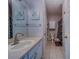 Well-lit bathroom with vanity, tile floor, and fresh decor at 1240 S Missouri Ave # 415, Clearwater, FL 33756