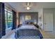 Comfortable bedroom with large window, ceiling fan, and decorative bedside lamps at 1240 S Missouri Ave # 415, Clearwater, FL 33756