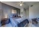 Serene bedroom featuring a ceiling fan, stylish decor, and bedside tables at 1240 S Missouri Ave # 415, Clearwater, FL 33756