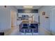 This kitchen has white appliances, an island with seating, and plenty of counter space at 1240 S Missouri Ave # 415, Clearwater, FL 33756