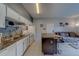 Efficient kitchen with white appliances, island, and view of the living area, perfect for entertaining at 1240 S Missouri Ave # 415, Clearwater, FL 33756