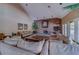 Comfortable living room featuring plush sofas, a stone fireplace, and ample natural light at 1240 S Missouri Ave # 415, Clearwater, FL 33756