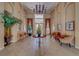 Grand lobby entrance with elegant decor, decorative plants, and chandelier at 1240 S Missouri Ave # 415, Clearwater, FL 33756