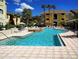 Enjoy this beautiful community pool and sundeck on sunny day in a lush tropical setting at 1240 S Missouri Ave # 415, Clearwater, FL 33756