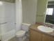 Bathroom showcasing a combination shower and bathtub at 13289 Arbor Pointe Cir # 201, Tampa, FL 33617