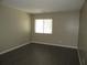 Bedroom with fresh paint, luxury vinyl flooring and a window at 13289 Arbor Pointe Cir # 201, Tampa, FL 33617