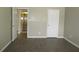 View of freshly painted bedroom showcasing vinyl flooring and neutral colors at 13289 Arbor Pointe Cir # 201, Tampa, FL 33617