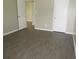 Bedroom featuring luxury vinyl plank flooring and neutral paint at 13289 Arbor Pointe Cir # 201, Tampa, FL 33617