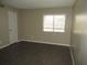 Well-lit bedroom with plank flooring and window at 13289 Arbor Pointe Cir # 201, Tampa, FL 33617
