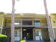Multi-Gathering building exterior with yellow siding, balconies, and stairways at 13289 Arbor Pointe Cir # 201, Tampa, FL 33617