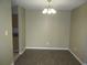 Bright dining area featuring modern flooring, neutral paint, and stylish lighting at 13289 Arbor Pointe Cir # 201, Tampa, FL 33617