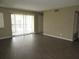 Open-plan living area boasts modern floors and neutral paint scheme at 13289 Arbor Pointe Cir # 201, Tampa, FL 33617