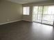 Comfortable living room with a sliding glass door offering natural light and a balcony view at 13289 Arbor Pointe Cir # 201, Tampa, FL 33617