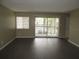 Bright living space featuring vinyl floors with a sliding glass door leading to balcony at 13289 Arbor Pointe Cir # 201, Tampa, FL 33617